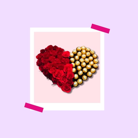 Heart shape made of red roses and gold chocolates in a white frame on pink background